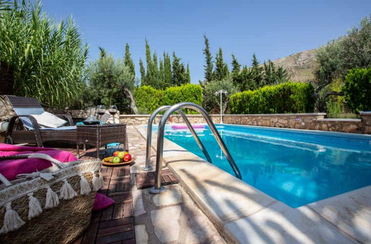 In the surrounding garden there is the swimming pool with sun terrace and the lush green countryside embellishes the villa making it a peaceful place.