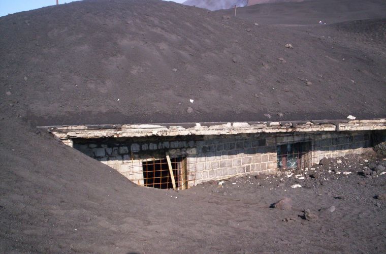 The Rifugio Torre del filosofo submerged by the lava flow