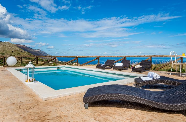 The property has a large natural garden scattered with milky white rocks, in this context is located the swimming pool with breathtaking views of the Gulf of Castellammare and the bay of Scopello.