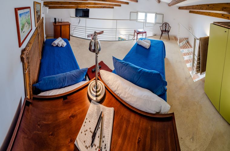 On the loft, there is a twin bedroom