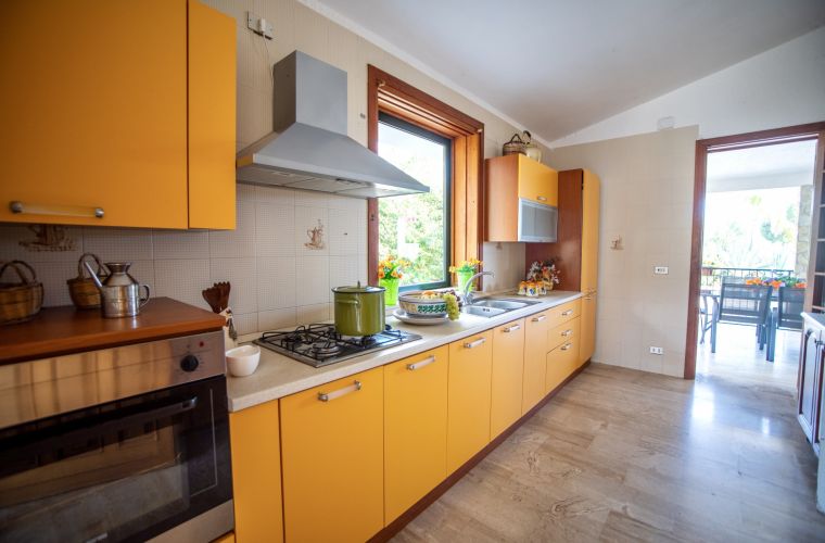 The well equipped kitchen is bright and cheerful and from here you can access two verandas where you can stay comfortably.