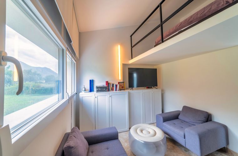 Double bedroom with lounge and bed in the loft