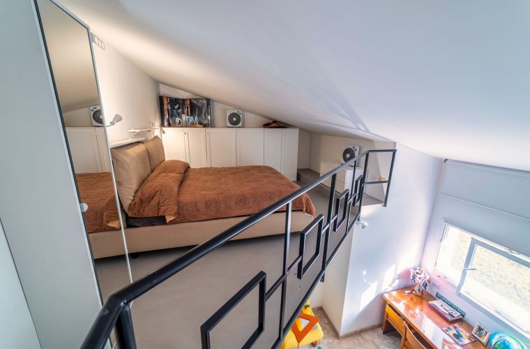 Another double bedroom with lounge and bed in the loft