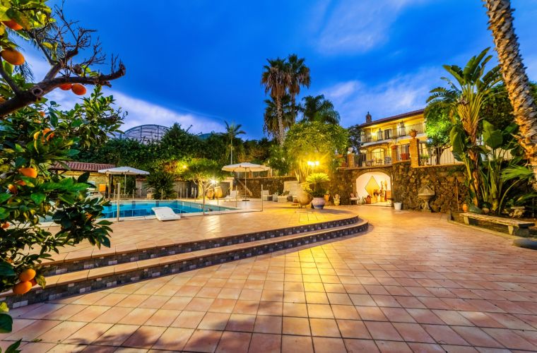 Tangerine tree, tropical plants, pool, facade