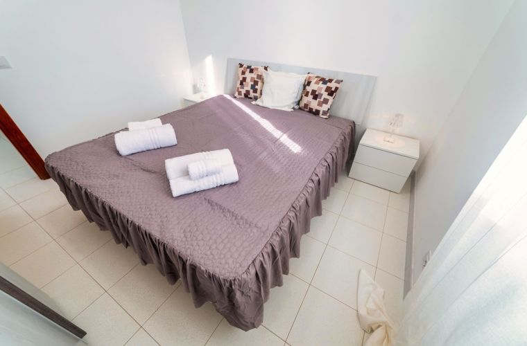 The interior has two double bedrooms plus one with a queen size bed; a bathroom, as well as the well-equipped living-kitchen.
