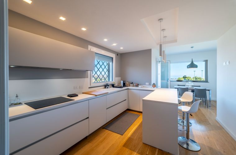 The stylish kitchen with a gorgeous panorama of the Mediterranean sea