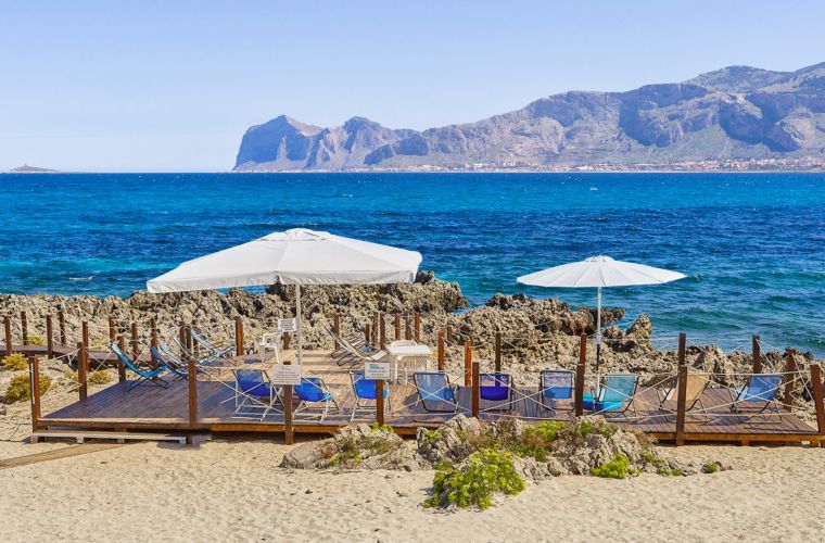 Private beach in front of the house