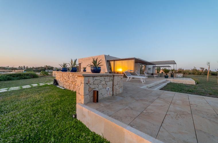 White stone, lawn, terrace facing the sea