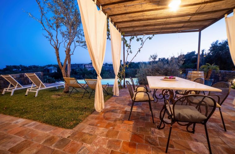 The BBQ is by the pool area: fish in Sicily, five stars food