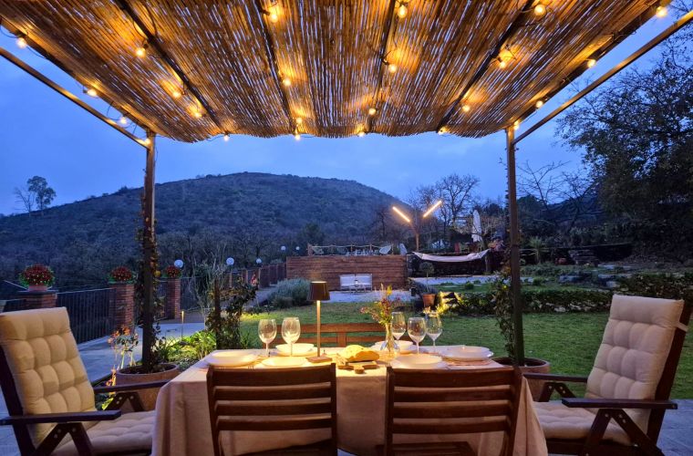 Patio outside the kitchen, facing the pool and the little conic shape of Serra