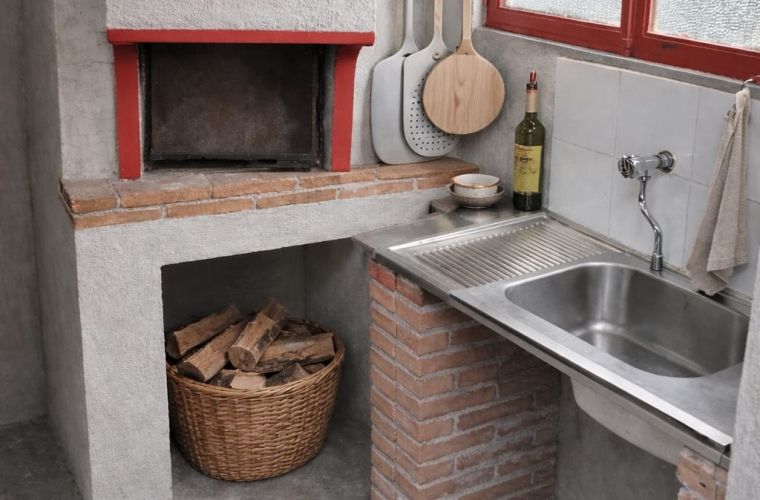 Pizza oven, adjacent the indoor kitchen