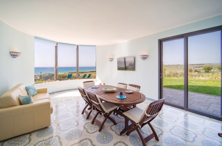 Glass windows, lawn and sea
