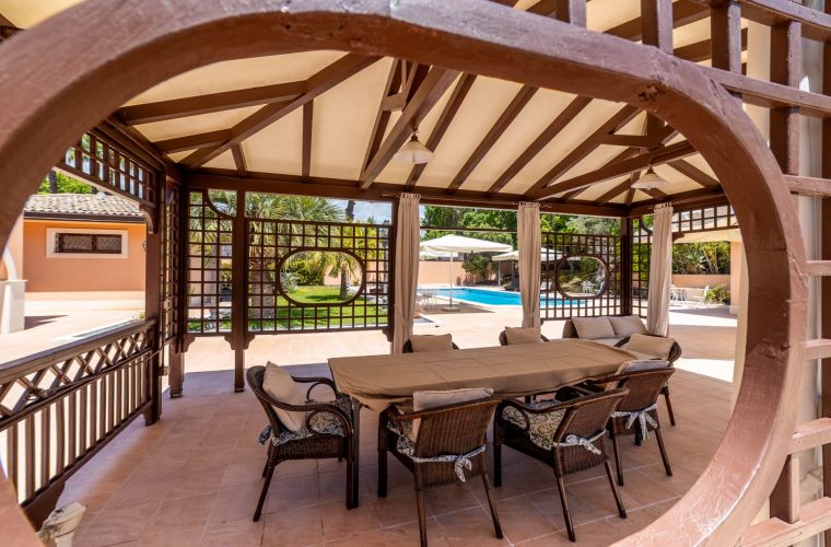 Patio facing the pool area and the interior kitchen