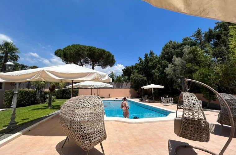 Sicilian woman inside the pool with a Sicilian dress