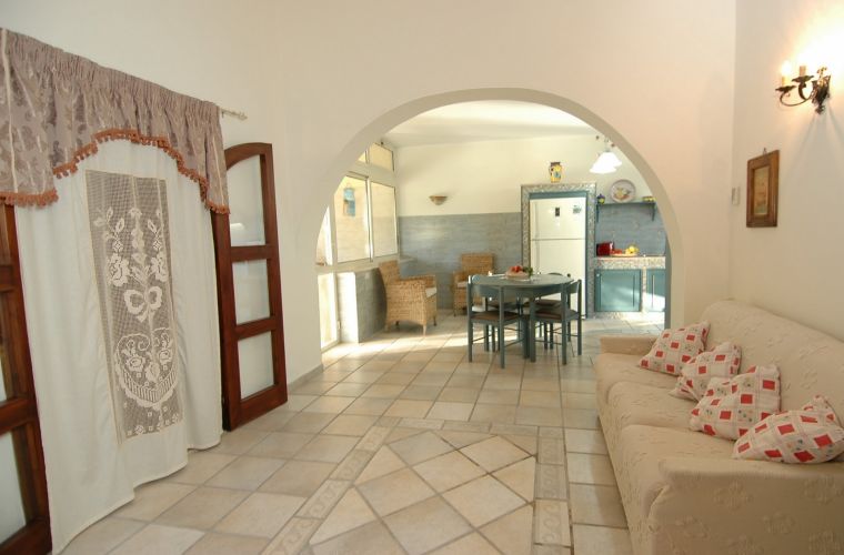 The villa extends on two levels; you access a well-finished and comfortable living room.
