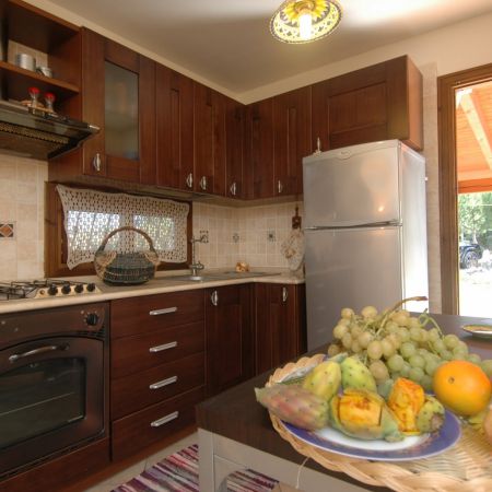 In a corner of the living room there is the well-structured kitchen, equipped with all the necessary.