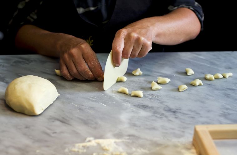 The making of pasta fresca: cutting the dough