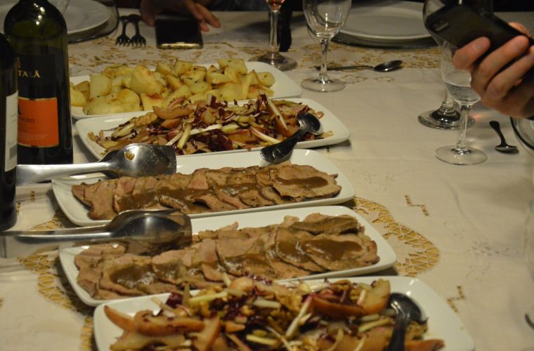 Delicious Sicilian meat courses: aggrassato and baked potatos