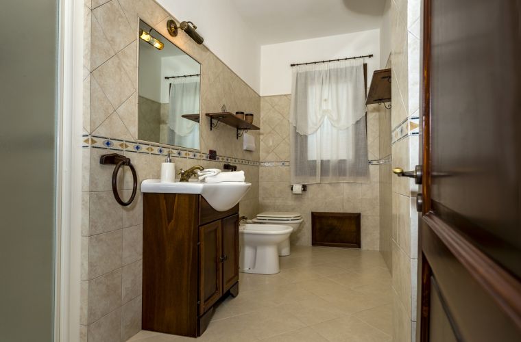 There are two bathrooms with shower. Another bathroom is located outdoor, to serve the pool area.